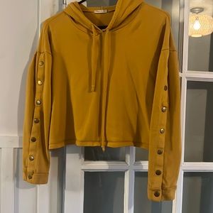 Yellow crop top hoodie with button sleeves